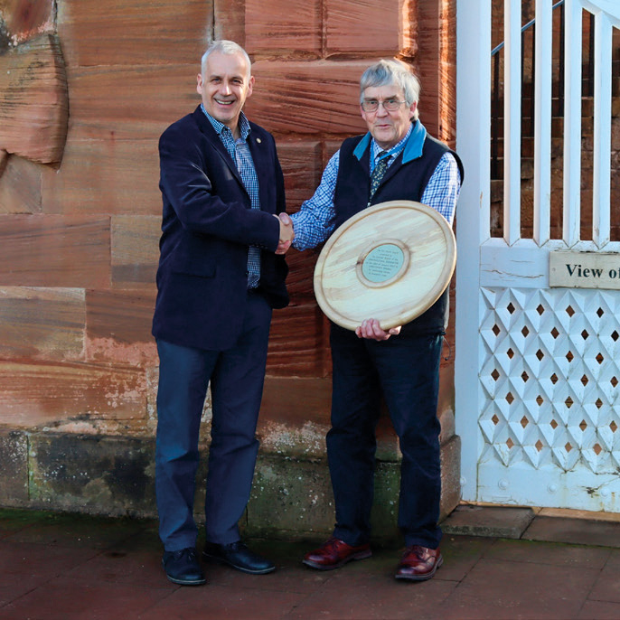 Christopher Dingwall (right) being presented with the Ken Martin award by Scottish Branch Chair Chris Simpson (left).