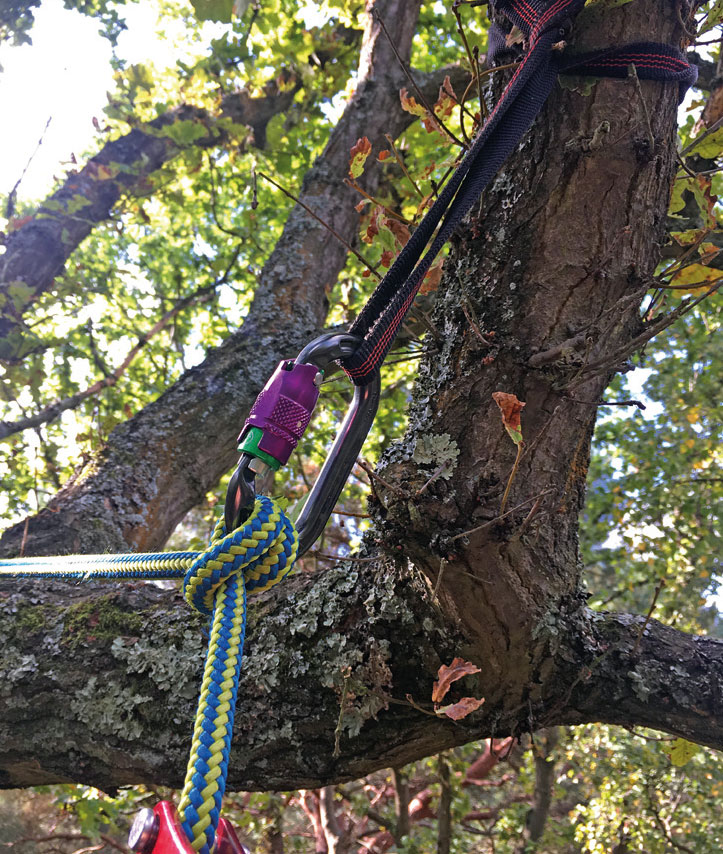 A redirect using a nylon tape sling, DMM durolock carabiner and a clove hitch with the climbing rope.