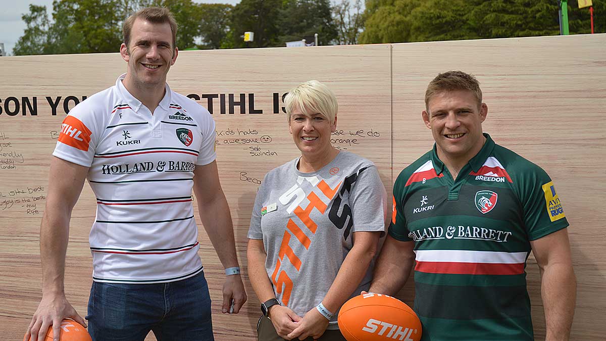 Tom Croft and Tom Youngs signing rugby balls at the STIHL rugby tackle game